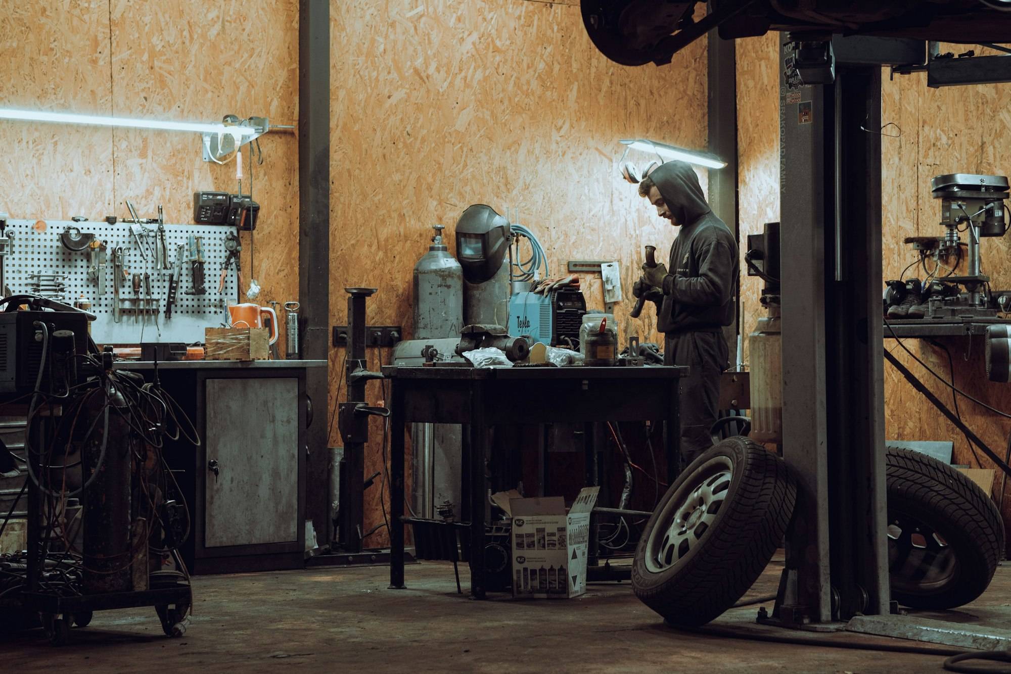 A mechanic working on machinery in a workshop